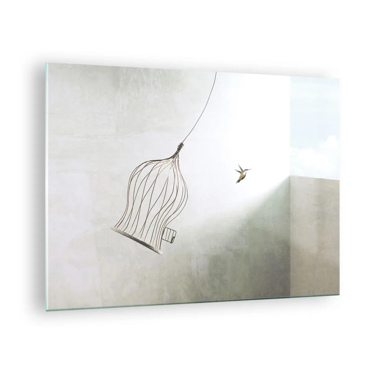 Glastavla - Bild på glas - En öppen bur och en kolibri som flyger iväg i dagsljus - 70x50cm - I sitt esse - Modern väggdekoration för vardagsrum och sovrum ARTTOR
