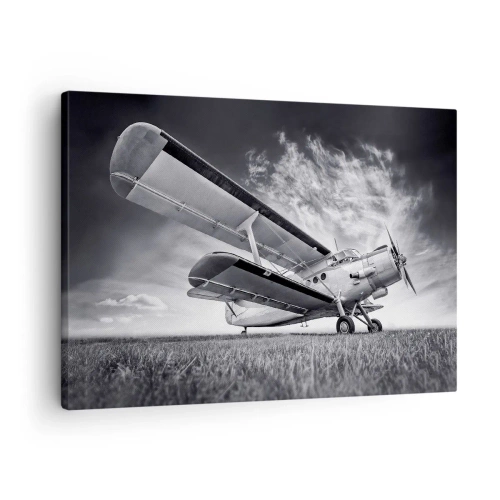 Canvastavla - Bild på duk - Ett flygplan mot en dramatisk himmel i svartvitt - 70x50cm - Bevingad vandrare - Modern väggdekoration för vardagsrum och sovrum ARTTOR