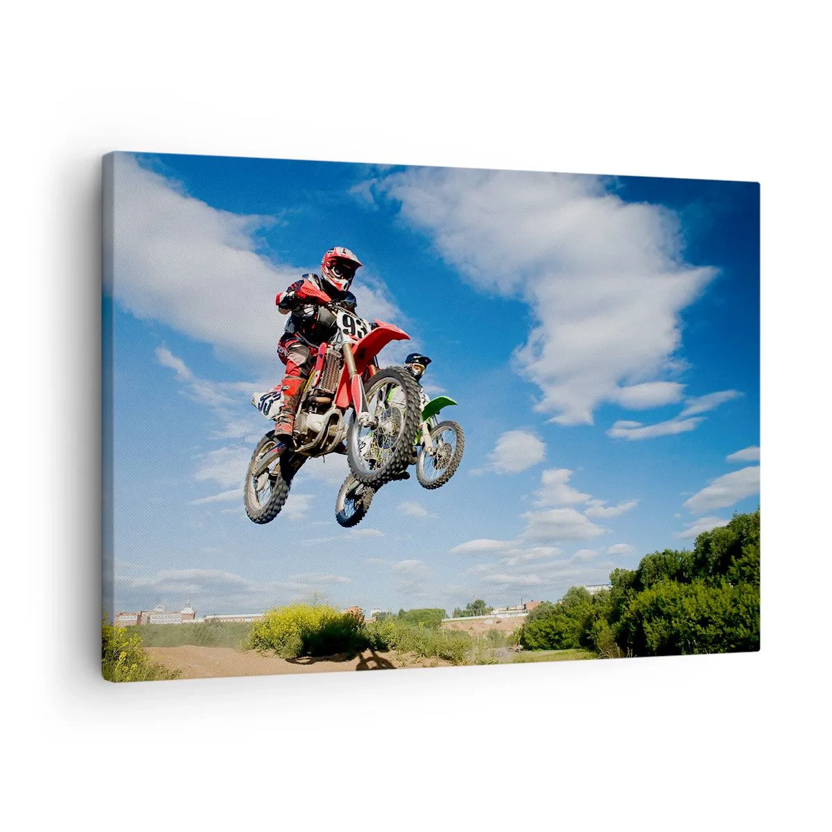 Canvastavla - Bild på duk - Förare på motocrosscyklar i luften under ett hopp - 70x50cm - Himmelsteg - Modern väggdekoration för vardagsrum och sovrum ARTTOR