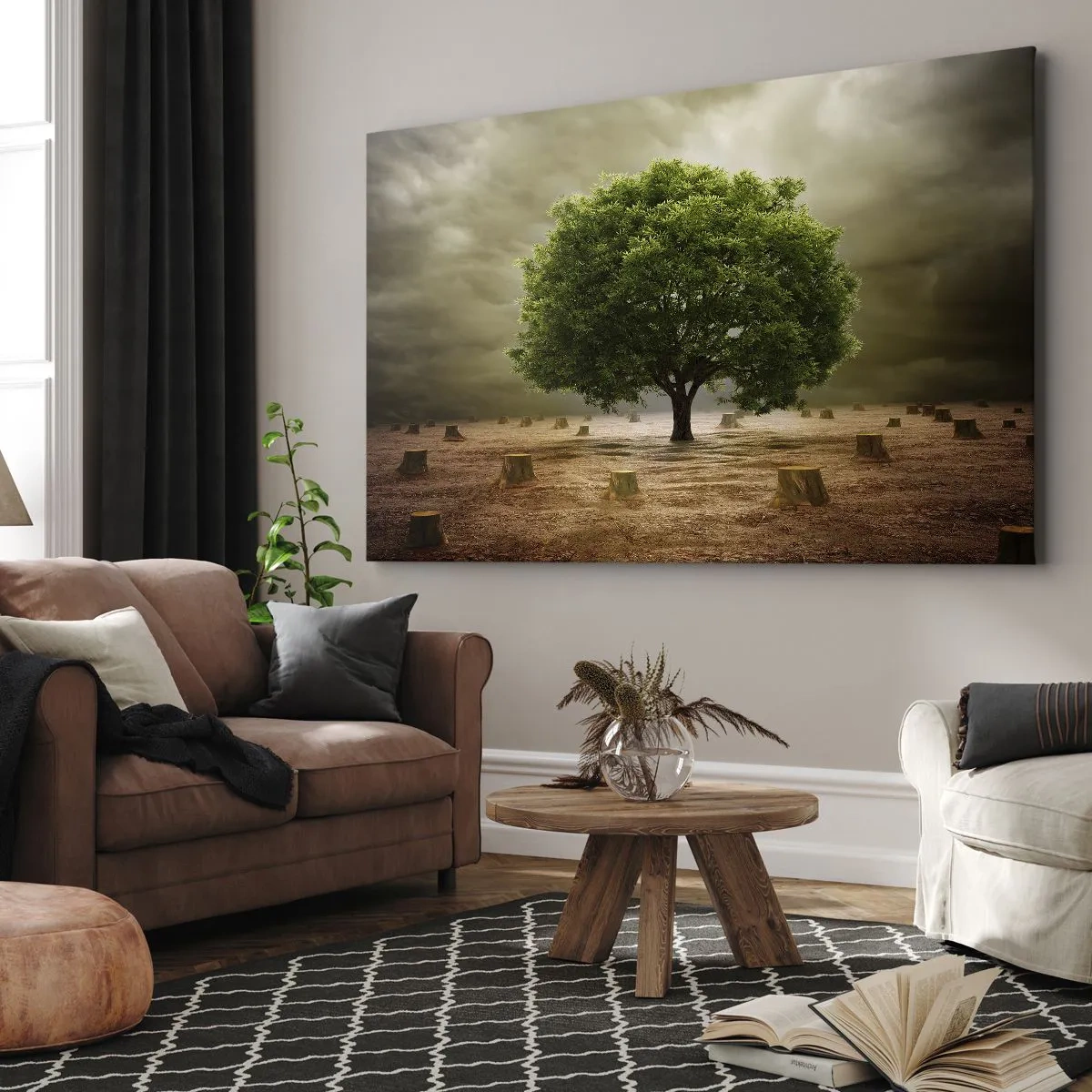 Canvastavla - Bild på duk - Ett grönt träd omgivet av fällda trädstammar mot en molnig himmel - 70x50cm - Hela hoppet - Modern väggdekoration för vardagsrum och sovrum ARTTOR