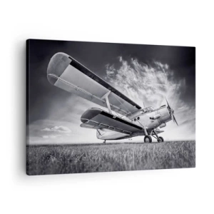 Canvastavla - Bild på duk - Ett flygplan mot en dramatisk himmel i svartvitt - 70x50cm - Bevingad vandrare - Modern väggdekoration för vardagsrum och sovrum ARTTOR