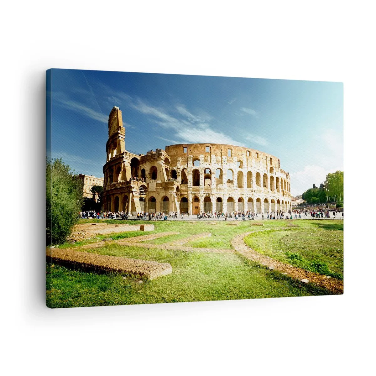 Canvastavla - Bild på duk - Colosseum i Rom omgivet av grönska och blå himmel - 70x50cm - Vapnets klang hörs fortfarande - Modern väggdekoration för vardagsrum och sovrum ARTTOR