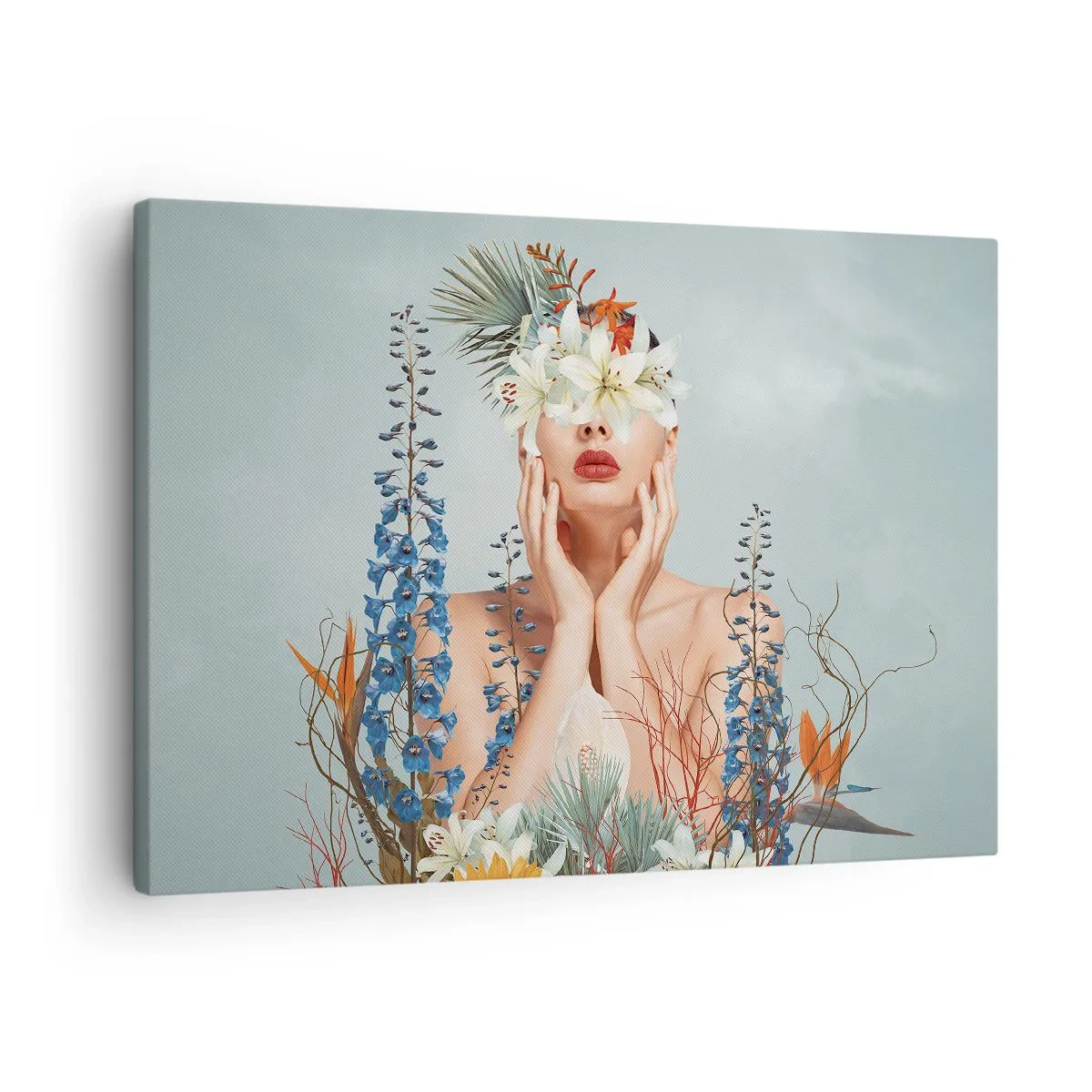 Canvastavla - Bild på duk - Porträtt av en kvinna med blommotiv mot en blå bakgrund - 70x50cm - Kvinna - blomma - Modern väggdekoration för vardagsrum och sovrum ARTTOR