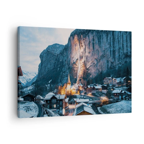 Canvastavla - Bild på duk - En pittoresk vinterby omgiven av berg - 70x50cm - Vinterns ljusa ande - Modern väggdekoration för vardagsrum och sovrum ARTTOR