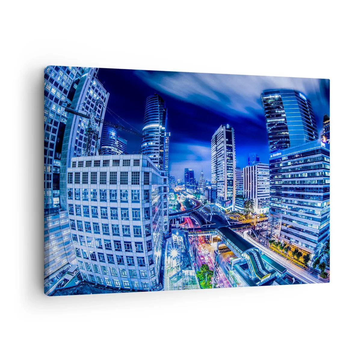 Canvastavla - Bild på duk - Nattstadspanorama med skyskrapor och gatubelysning - 70x50cm - Stadens nattrytmer - Modern väggdekoration för vardagsrum och sovrum ARTTOR