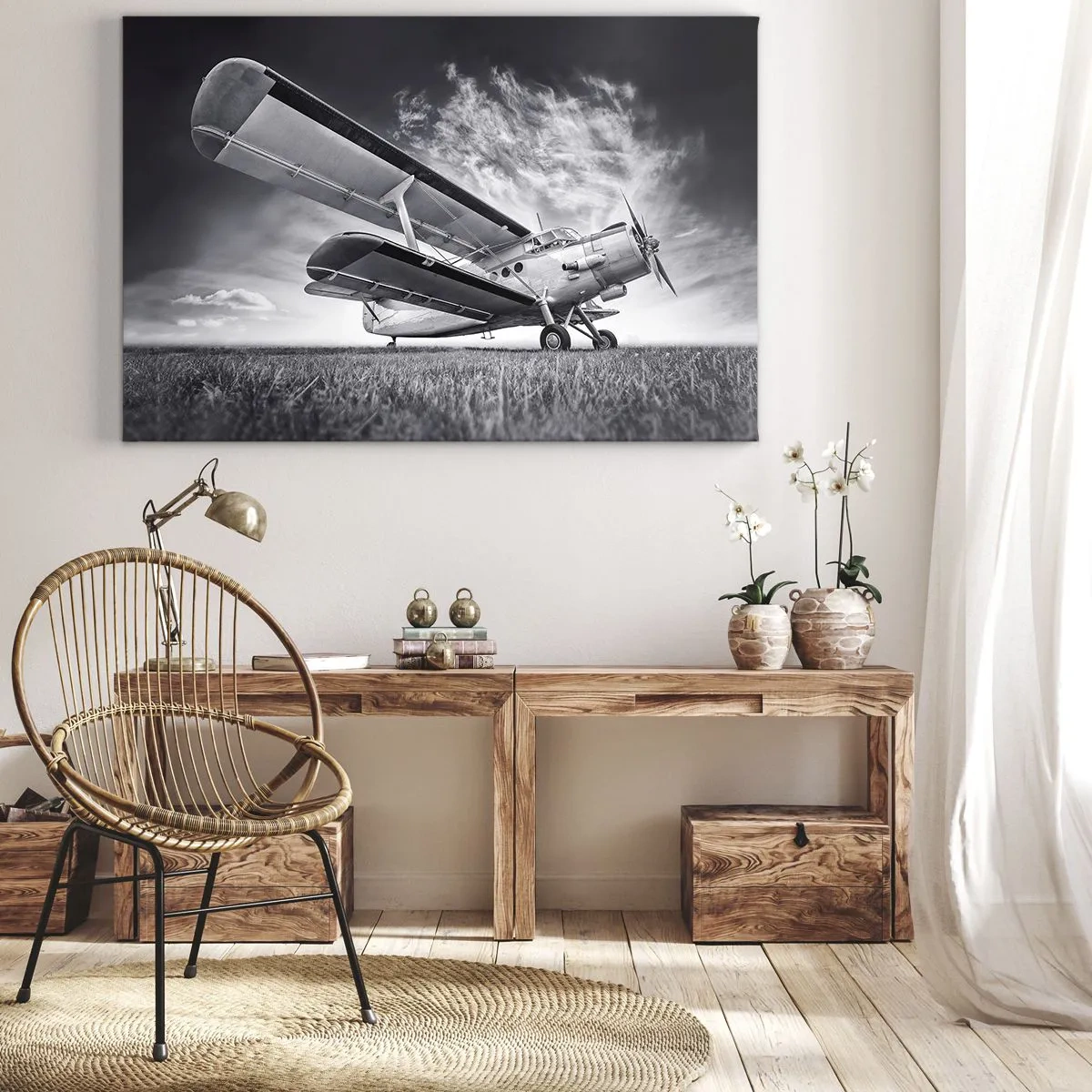Canvastavla - Bild på duk - Ett flygplan mot en dramatisk himmel i svartvitt - 70x50cm - Bevingad vandrare - Modern väggdekoration för vardagsrum och sovrum ARTTOR