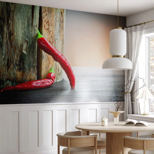 Fototapet Standard Eco - Röda chilipeppar på en träbakgrund - 100x70cm - Red hot chili peppers - Modern väggdekoration för vardagsrum och sovrum ARTTOR