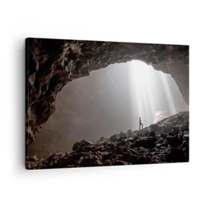 Canvastavla - Bild på duk - En figur i en grotta upplyst av ljusstrålar - 70x50cm - Ljusfylld grotta - Modern väggdekoration för vardagsrum och sovrum ARTTOR