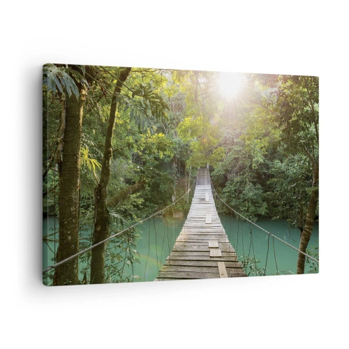 Canvastavla - Bild på duk - En hängbro i en tropisk skog upplyst av solljus. - 70x50cm - Vid azurblått vatten till azurblå skog - Modern väggdekoration för vardagsrum och sovrum ARTTOR