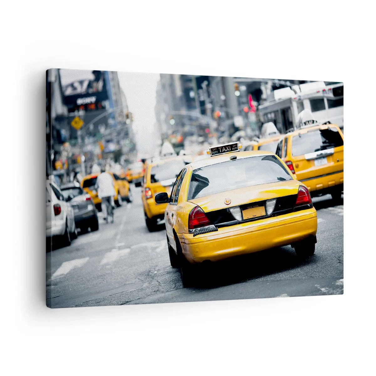 Canvastavla - Bild på duk - Gula taxibilar på en livlig stadsgata i metropolens centrum - 70x50cm - Endast i denna stad - Modern väggdekoration för vardagsrum och sovrum ARTTOR