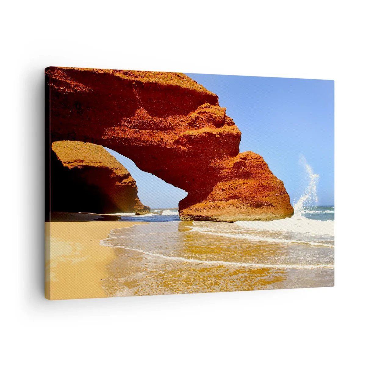 Canvastavla - Bild på duk - En naturlig klippbåge på en strand med blå himmel och vågor - 70x50cm - Vatten och vind i tusentals år - Modern väggdekoration för vardagsrum och sovrum ARTTOR