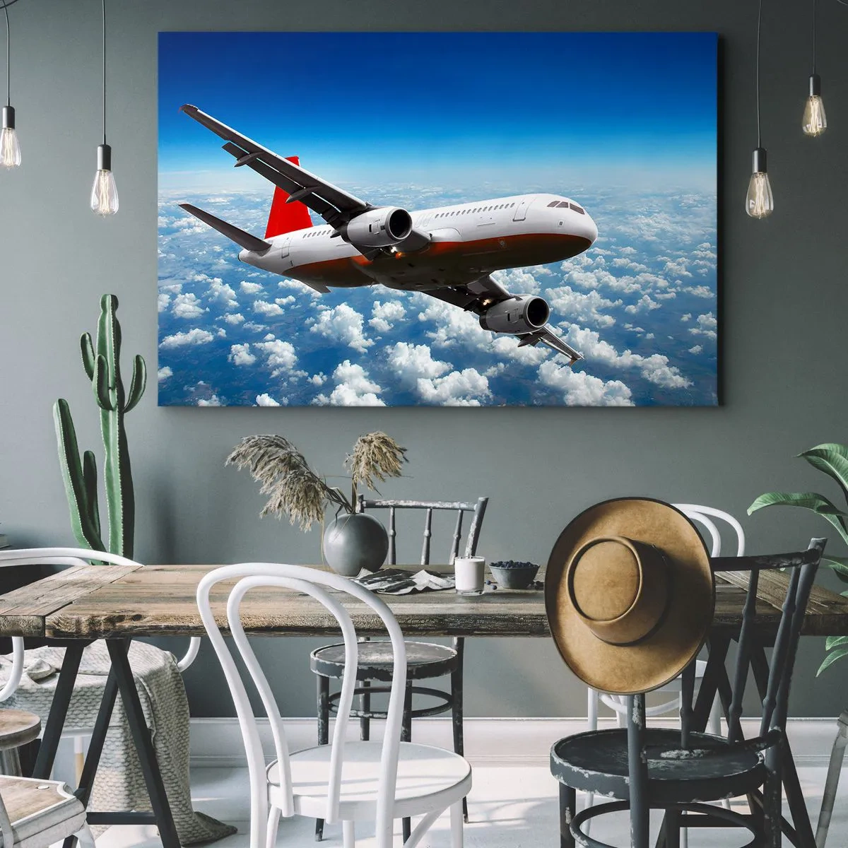 Canvastavla - Bild på duk - Ett passagerarplan som flyger över molnen mot en blå himmel. - 70x50cm - Lämna allt detta - Modern väggdekoration för vardagsrum och sovrum ARTTOR