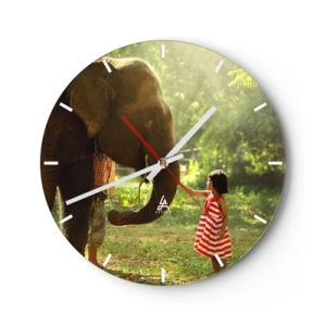 Väggklocka - Klocka på glas - En flicka i röd klänning rör vid en elefants snabel i skogen. - 30x30cm - Vänskapens styrka - Modern väggdekoration för vardagsrum, kök och sovrum ARTTOR