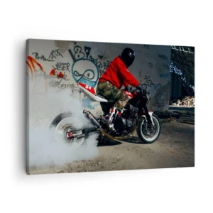 Canvastavla - Bild på duk - En motorcyklist utför en spektakulär drift i en övergiven byggnad täckt av graffiti. - 70x50cm - Jaga mig! - Modern väggdekoration för vardagsrum och sovrum ARTTOR